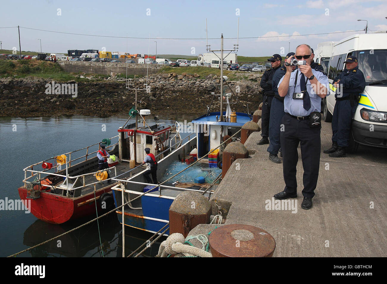 Gardai at the scene on Ballyglass pier outside Belmullet, after two local fishermen, Pat and Jonathan O'Donnell, had their boats, John Michel and James Collins (pictured), impounded on Thursday morning. Stock Photo