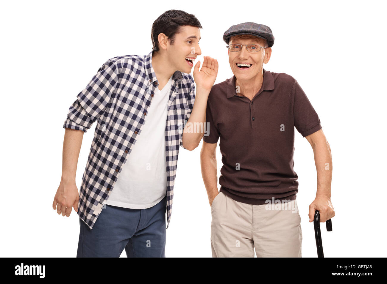 Young man whispering something to his grandpa isolated on white background Stock Photo