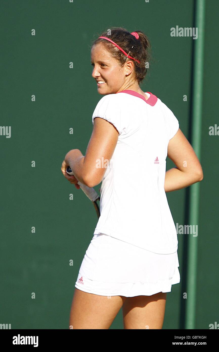 Great Britain's Laura Robson smiles after she has to take evasive action from an insect on match point in her Girls' Singles Second Round match against Australia's Sally Peers during the Wimbledon Championships 2009 at the All England Tennis Club in Wimbledon. Stock Photo