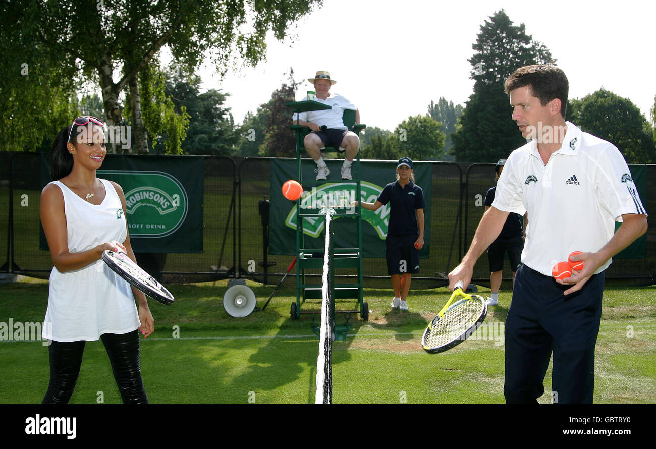 Singer Alesha Dixon plays tennis with former British number 1 Tim Henman on the Robinsons Mini Court before the 2009 Wimbledon Championships at the All England Lawn Tennis and Croquet Club, Wimbledon, London. Stock Photo