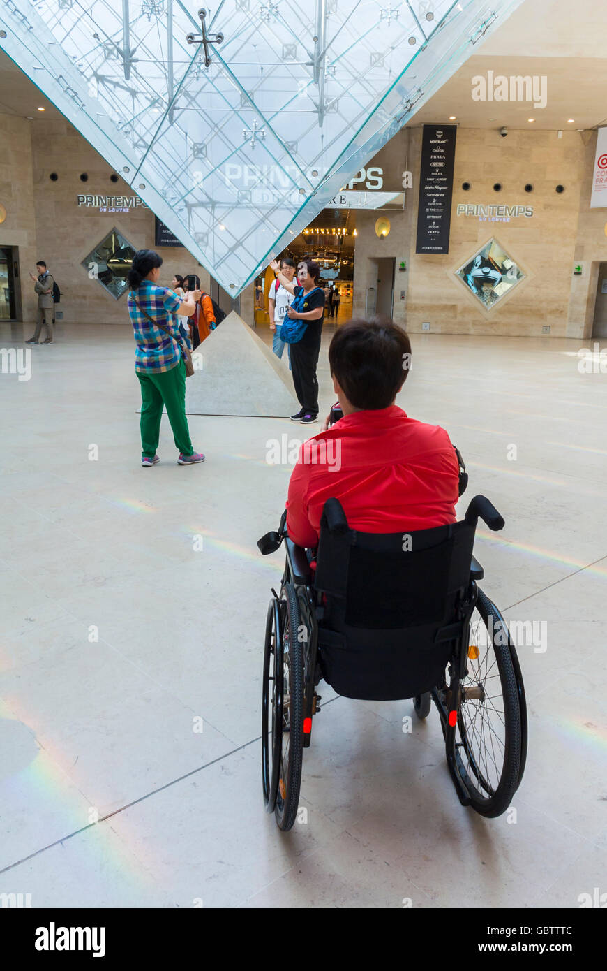Paris, France, Handicapped Tourist in Wheelchair, taking photos, French