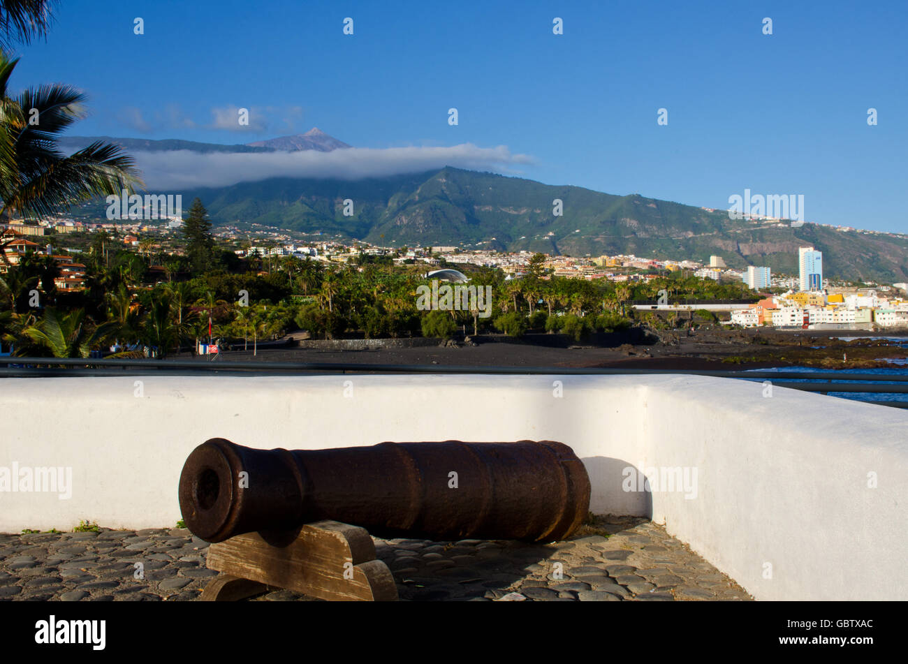 Puerto de la Cruz Old Canon on fort with Teide volcano, island Teneriffe, Canary Islands, Spain Stock Photo