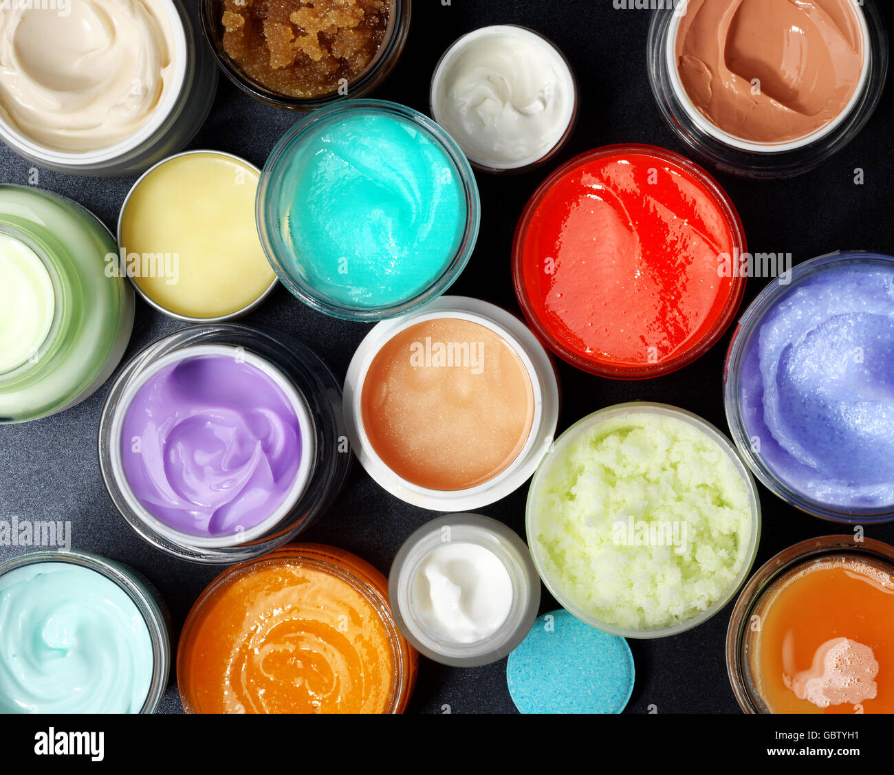 Sudio shot of colorful scrubs and creams. View from above. Stock Photo