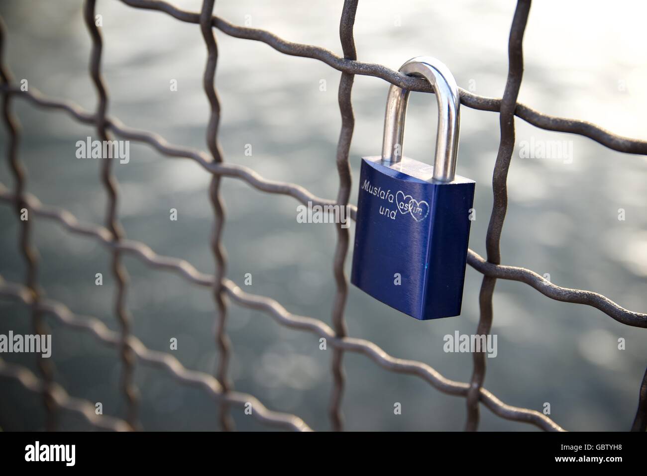 Love padlock on the railing of a bridge, Berlin, Germany Stock Photo