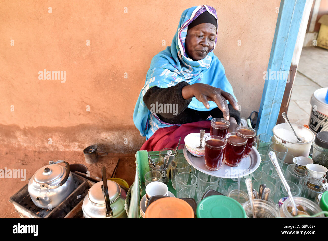 Africa, Sudan, woman preparing tea Stock Photo
