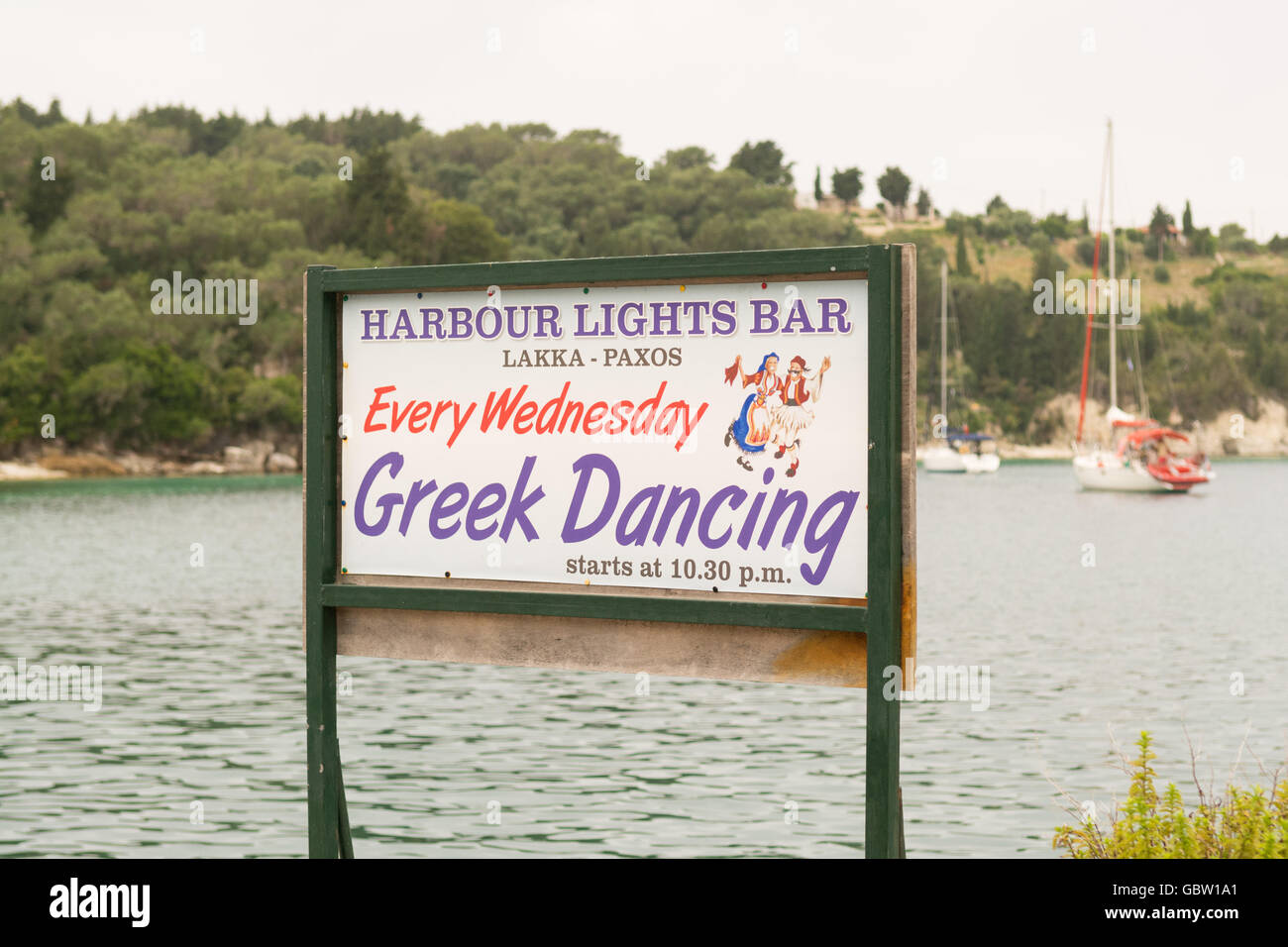Greek Dancing sign,  Harbour Lights Bar, Lakka, Paxos, Greece Stock Photo