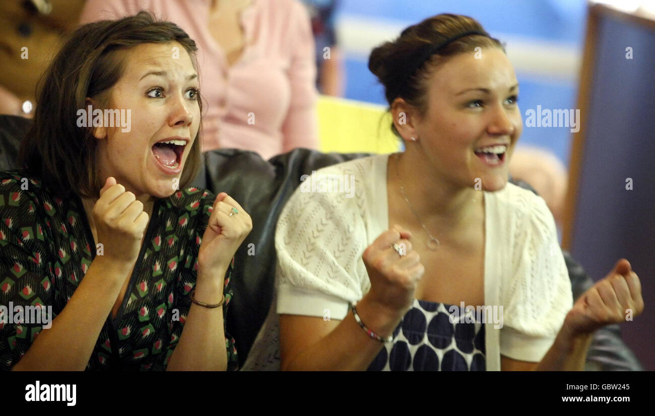 Emma John (left), 22, and Suzy Biggart, 22, at the Dunblane Centre, watch Andy Murray in action against Andy Roddick in their Wimbledon semi-final match in Murray's home town of Dunblane. Murray aims to be the first Britain in 71 years to reach the men's singles final at the All-England Club. Stock Photo