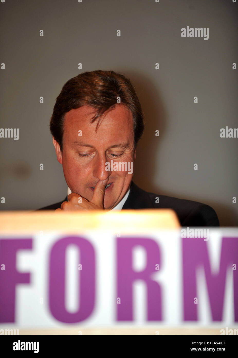 Conservative Party leader David Cameron addresses the Reform think-tank pledging to cut the number of quangos - starting with communications regulator Ofcom, at the Clifford Chance building, in London Docklands. Stock Photo