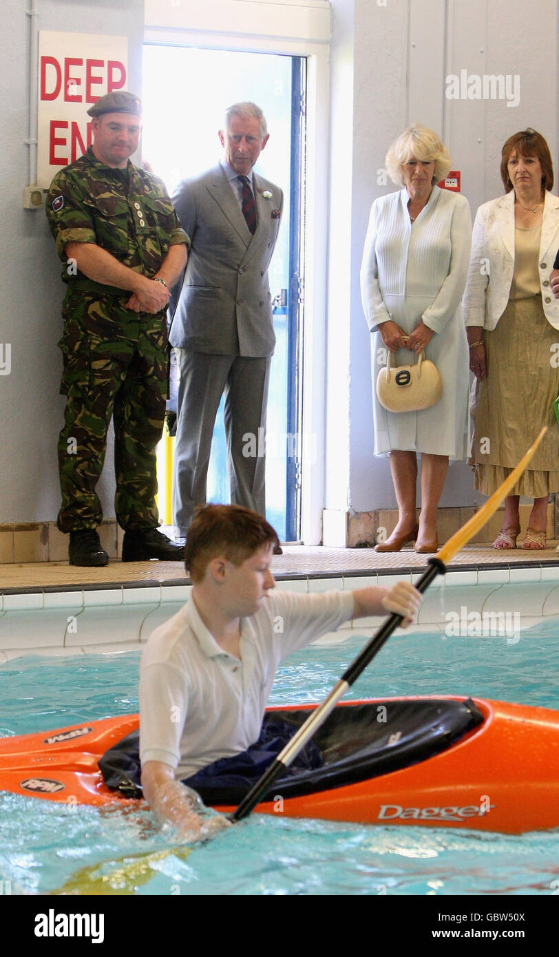 Camilla, Duchess of Cornwall and Prince Charles, Prince of Wales, watch a canoe demonstration during a visit to Treorchy Comprehensive School in Wales. Stock Photo