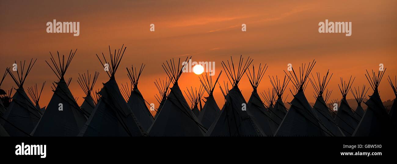 A view of the sun setting over the 2009 Glastonbury Festival at Worthy Farm in Pilton, Somerset. Stock Photo