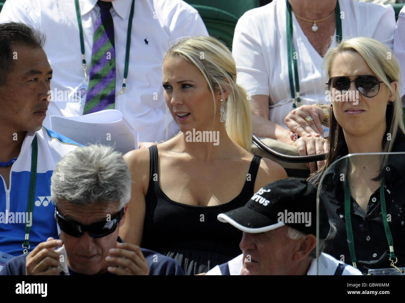 Bec Cartwright watches her husband Lleyton Hewitt in action during the 2009 Wimbledon Championships at the All England Lawn Tennis and Croquet Club, Wimbledon, London. Stock Photo