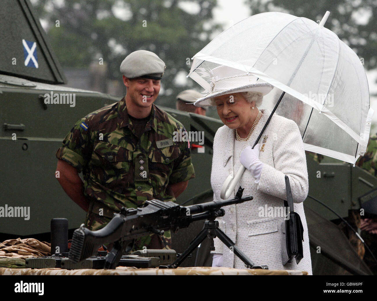 Queen Elizabeth II view weaponry during a visit to The Royal Scots Dragoon Guards at Redford Barracks, Edinburgh. Stock Photo