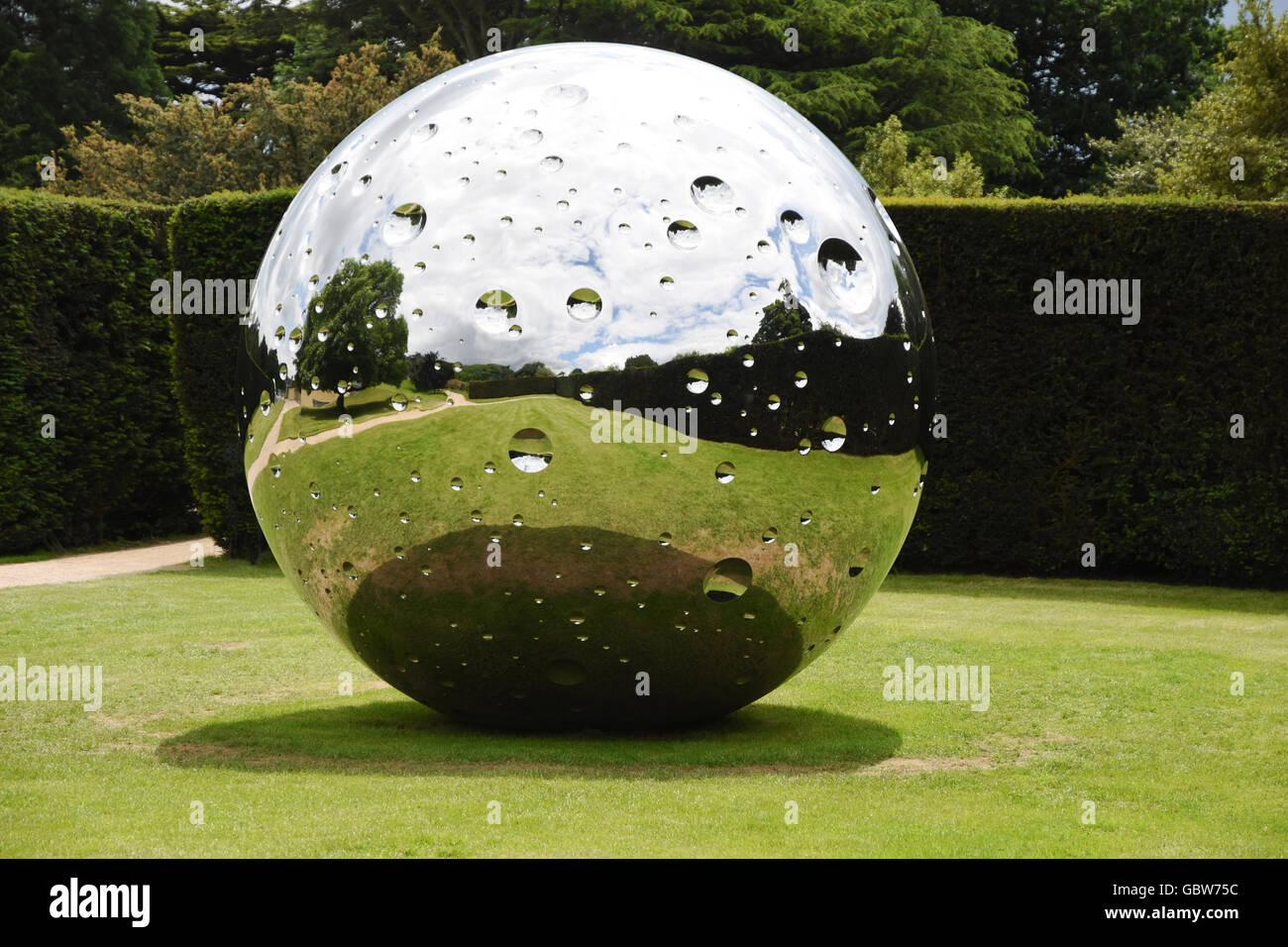 'Moon' a stainless steel sculpture by Not Vital, displayed in the grounds of the Yorkshire Sculpture Park, UK. (2016) Stock Photo