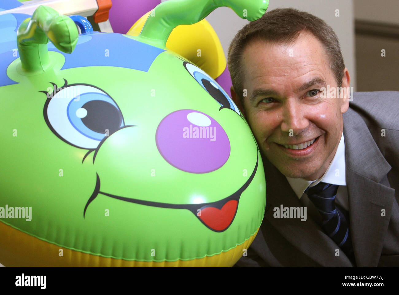 American artist Jeff Koons poses with 'Caterpillar Ladder, 2003' at an exhibition of work from his 'Popeye' series, at the Serpentine Gallery, London. Stock Photo