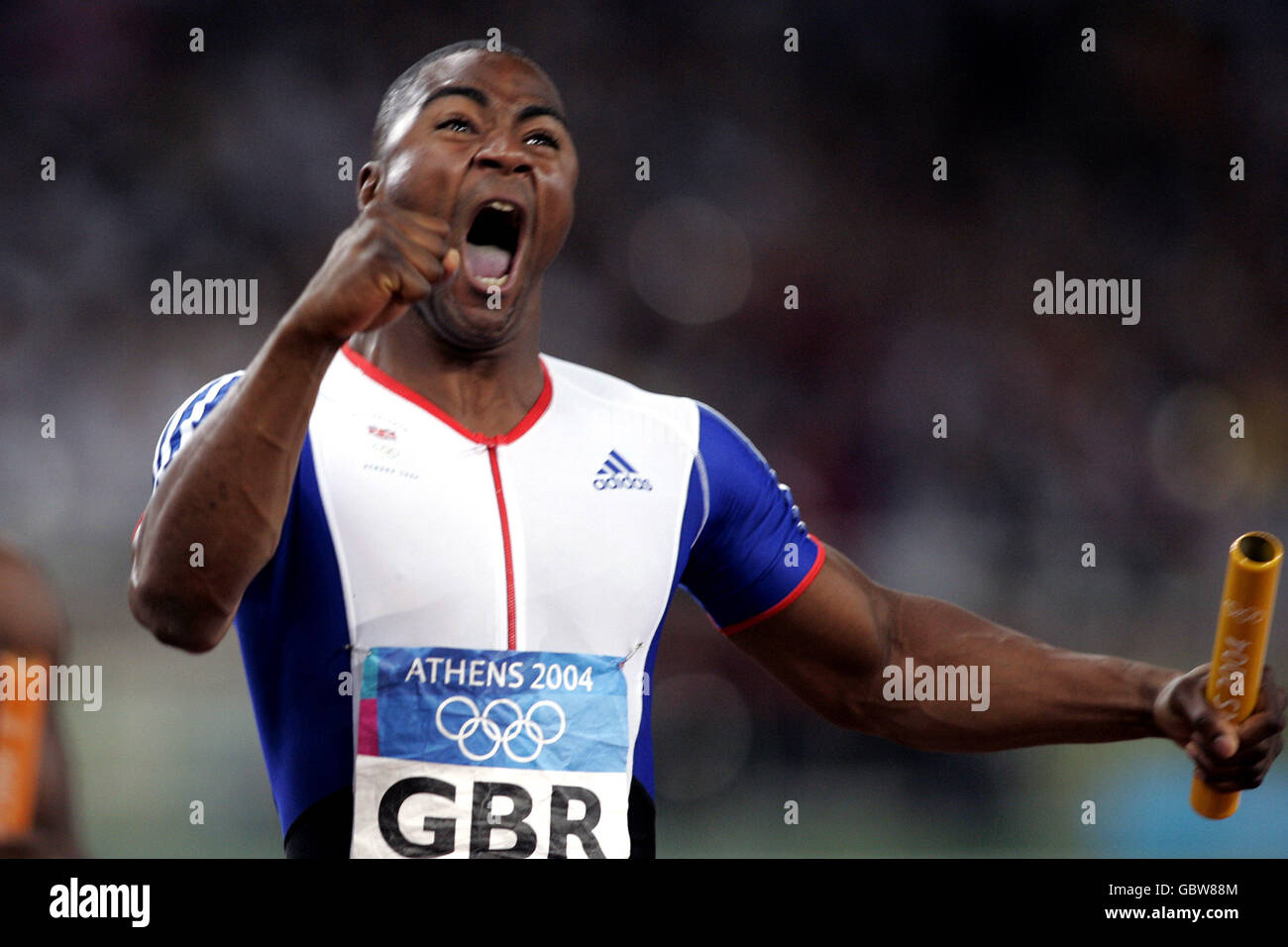 Athletics - Athens Olympic Games 2004 - Men's 4 x 100m Relay - Final. Great Britain's Mark Lewis-Francis celebrates after bringing the 4x100m relay team home to the gold medal Stock Photo
