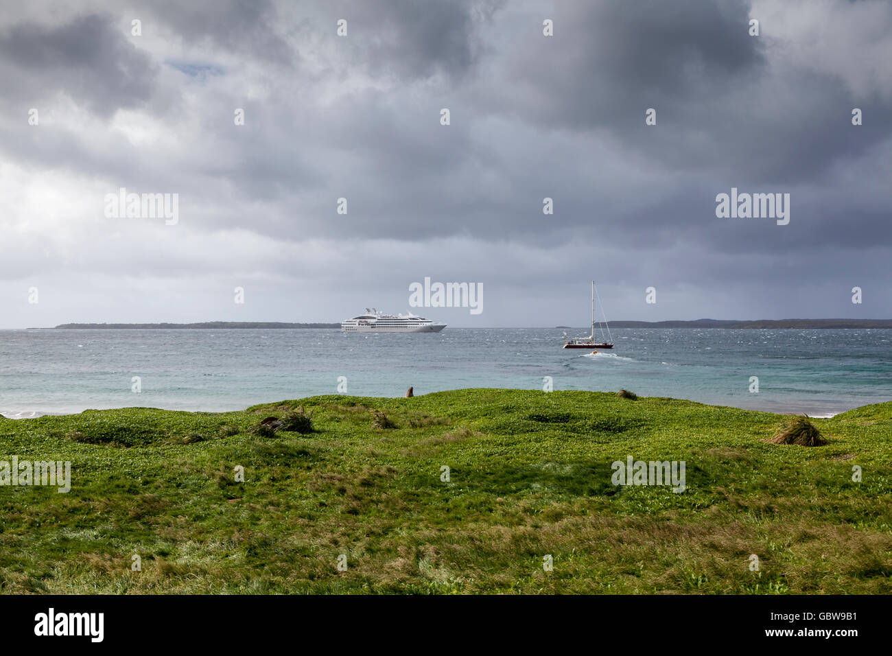 French expedition ship Le Soleal and Tiama yacht at Enderby Island, Auckland Islands, New Zealand Stock Photo