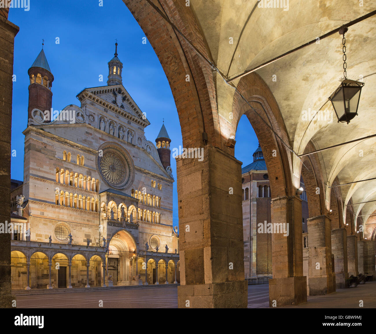 Cremona - The cathedral  Assumption of the Blessed Virgin Mary  and the portico of the Town hall at dusk. Stock Photo