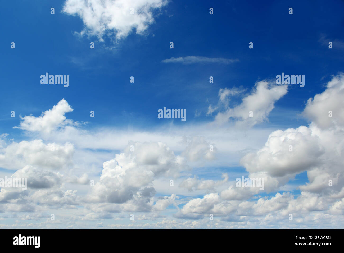 The white cumulus clouds against the blue sky Stock Photo - Alamy