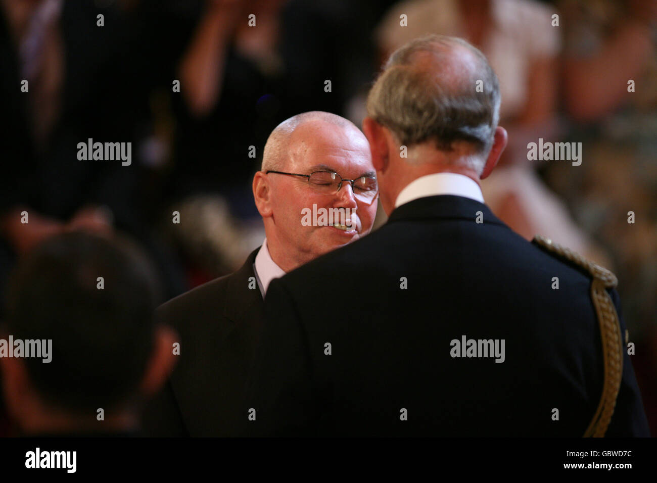 Dr. Stephen Davis from London is made an OBE by the Prince of Wales at