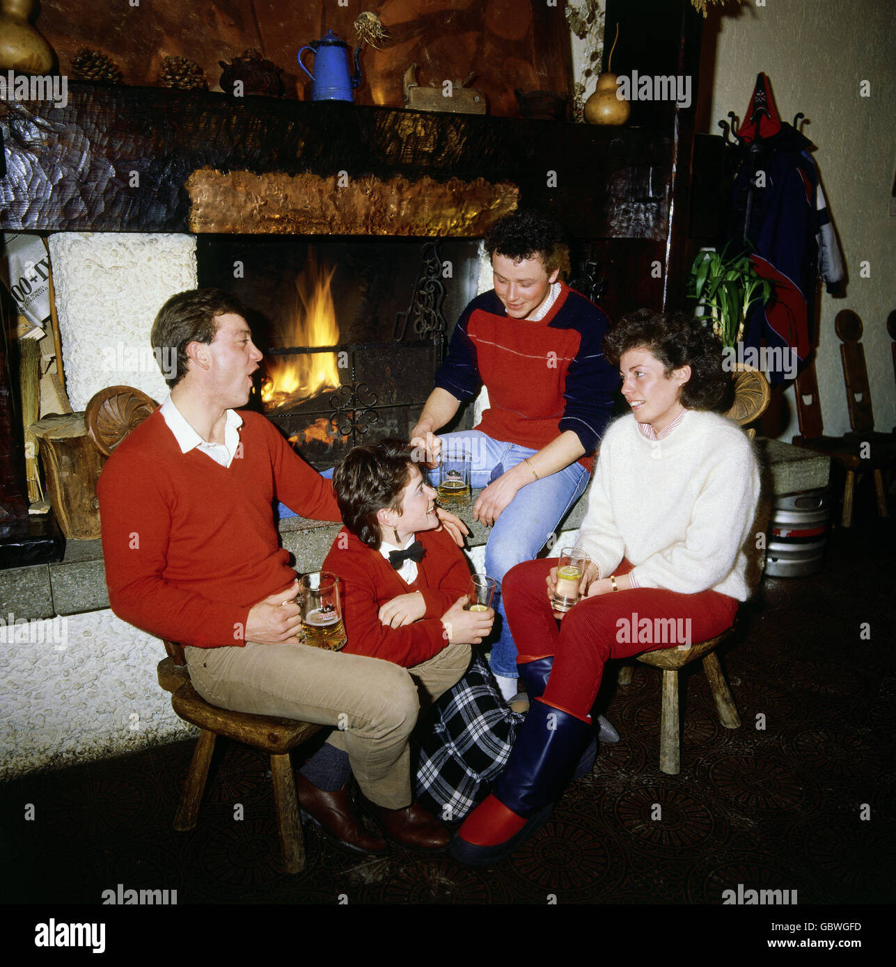 festivity, parties, two couples sitting at chimney, drinking beer, 1980s, , Additional-Rights-Clearences-Not Available Stock Photo