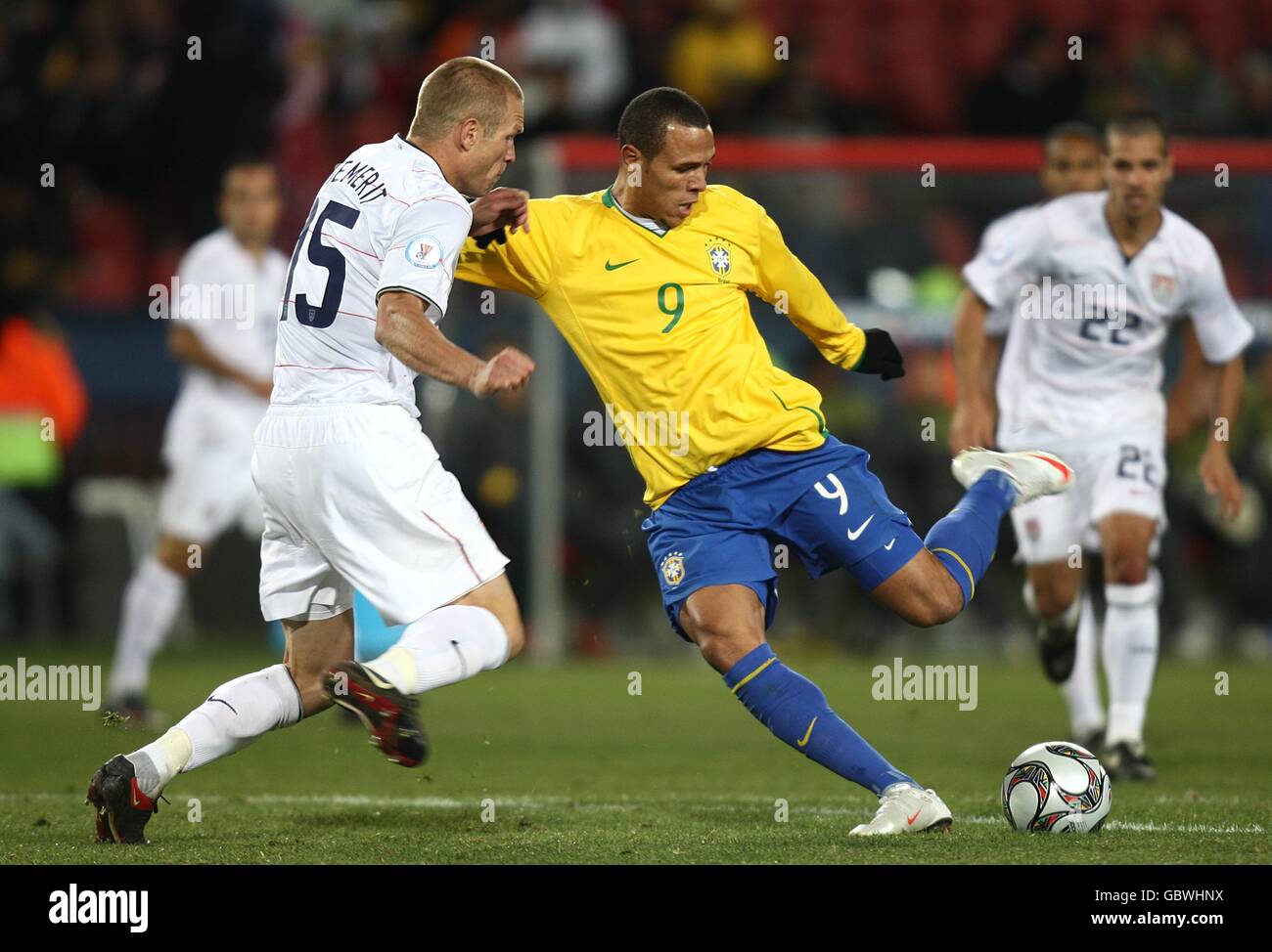 Soccer - 2009 FIFA Confederations Cup - Final - USA v Brazil - Ellis Park. Brazil's Luis Fabiano (right) scores their first goal past USA's Jay DeMerit (left) Stock Photo