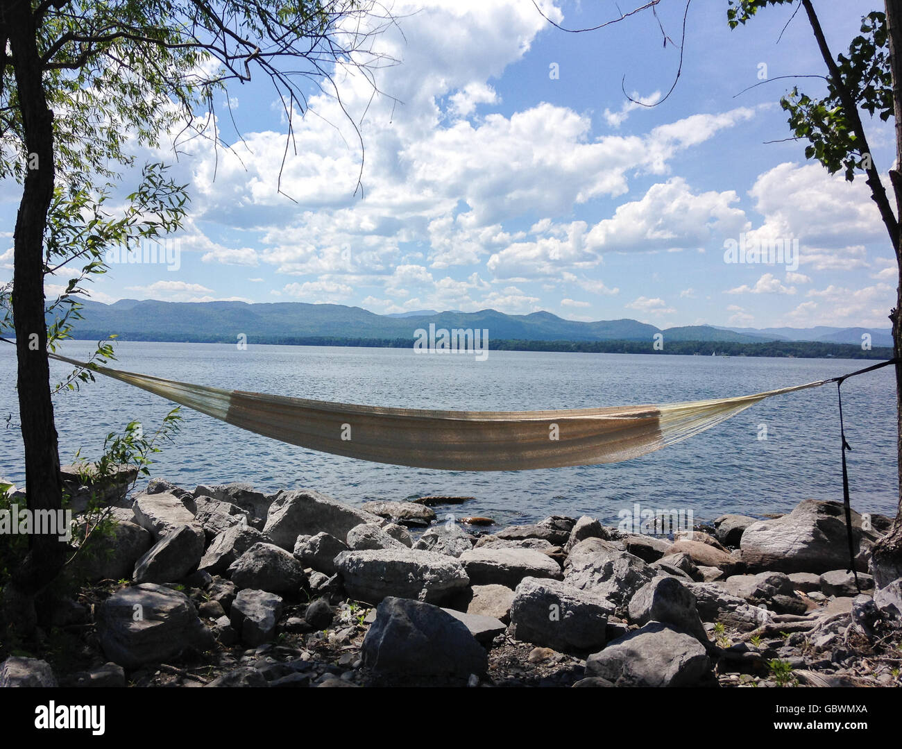 Hammock with the view on the lake Champlain, Vermont. Arnold Bay Stock
