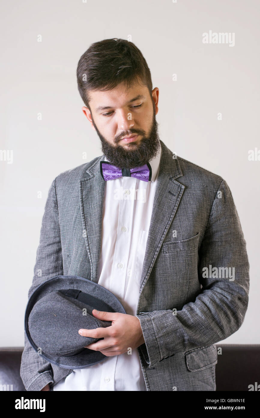 Fashionable man in a suit with a bow tie Stock Photo