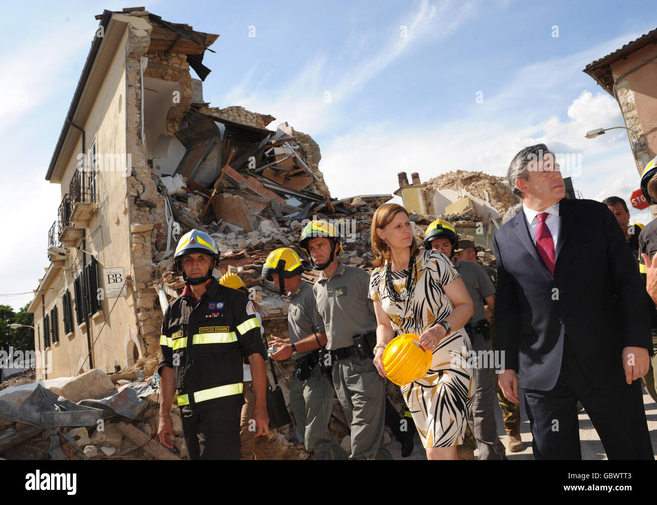 Prime Minister Gordon Brown (right) and his wife, Sarah Brown (2nd right) visit the ruined village of Onna near L'Aquila, Italy which was at the epicentre of the earthquake which struck the region on April 6, 2009. Stock Photo