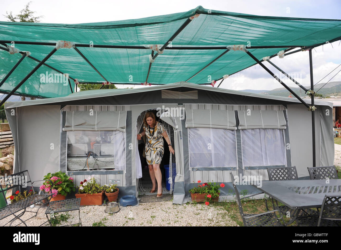 Sarah Brown leaves a tent which is now home to British woman Joanna Griffith-Jones, 46, whose house in the village of Onna near L'Aquila, Italy was destroyed by the earthquake of April 6, 2009. Stock Photo