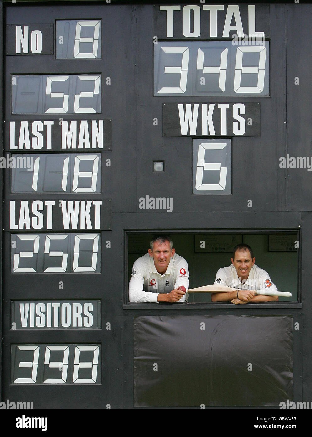 Cricketing legends Andy Caddick (left) and Justin Langer at Finchley Cricket Club, London with some of their best statistics in support of Get On, the Government campaign helping people in England to brush up their maths skills. Stock Photo