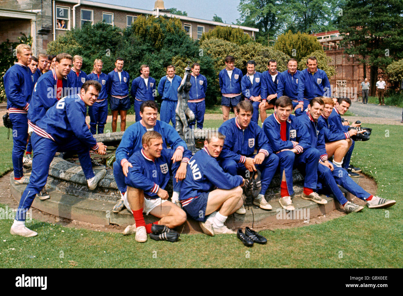 The possible members of England's World Cup squad gather around a fountain at Lilleshall: (standing, l-r) Bobby Moore, Ian Callaghan, Jack Charlton, Peter Bonetti, Gordon Banks, Gordon Milne, Ron Flowers, John Connelly (leaning), Bobby Charlton, Jimmy Armfield, Nobby Stiles, trainer Les Cocker, coach Wilf McGuinness, Norman Hunter, trainer Harold Shepherdson, Gerry Byrne, George Cohen, Ron Springett; (sitting, l-r) Johnny Byrne (back), Peter Thompson, George Eastham, Geoff Hurst, Martin Peters, Keith Newton, Alan Ball, Terry Paine Stock Photo