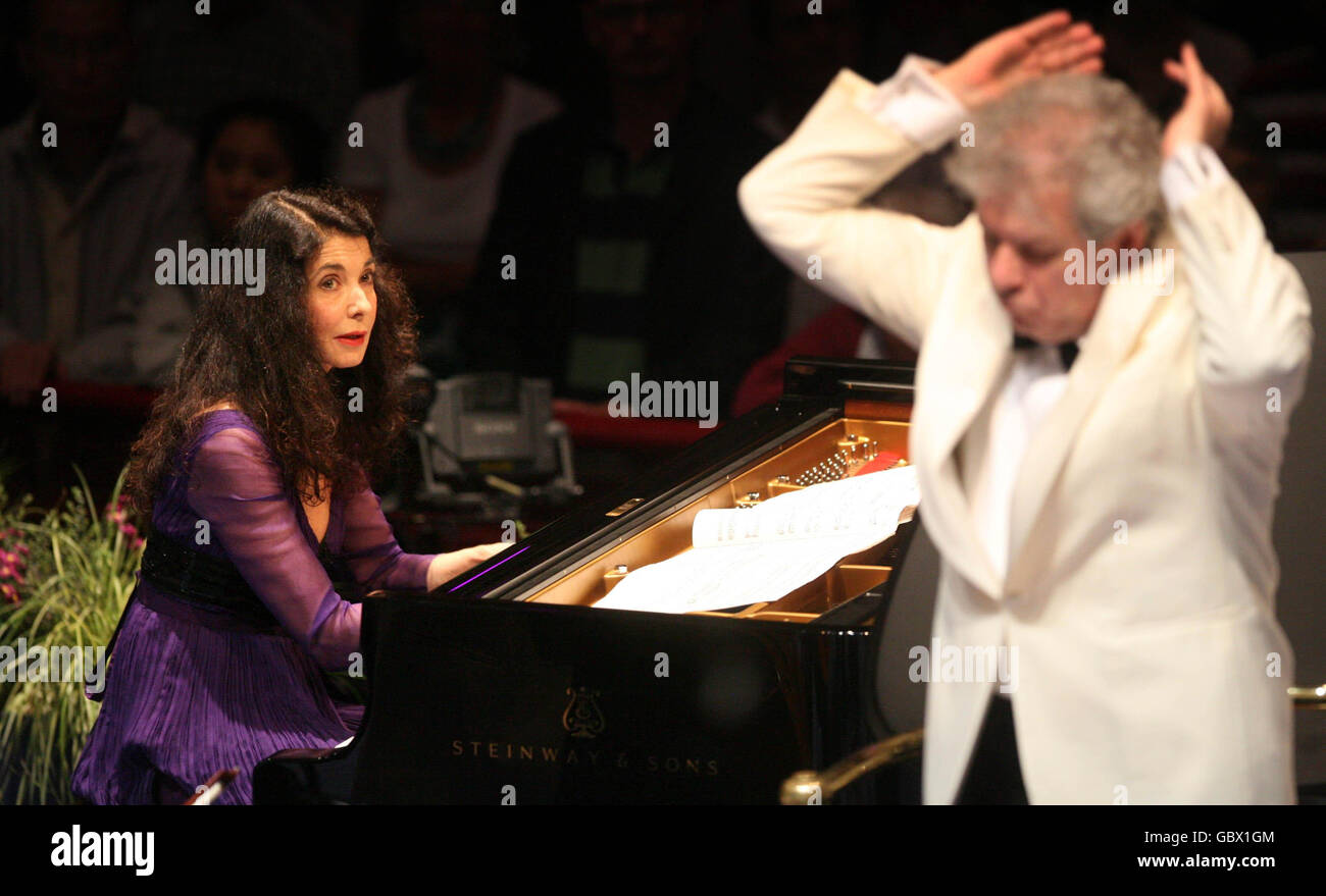 Pianist Marielle Labeque looks at Conductor Jiri Belohlavek at the First Night of the Proms 2009 in the Royal Albert Hall, London. Stock Photo