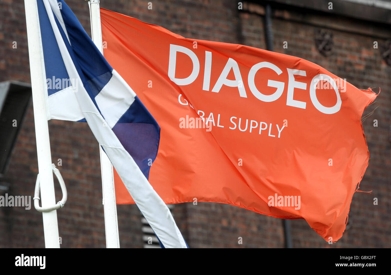 A general view of flags at the Diageo complex in Port Dundas, Glasgow, after it was announced that around 900 jobs are being axed by the drinks group in Scotland as part of an overhaul which will see the closure of its historic distillery. Stock Photo