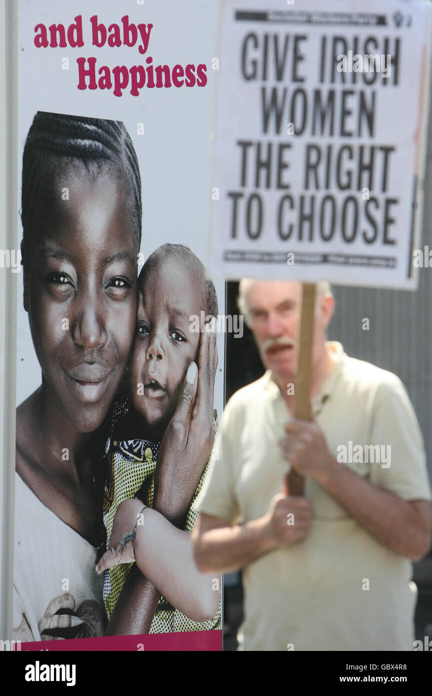 A man holds a placard on Dublin's O'Connell street during a pro-abortion demonstration. Stock Photo