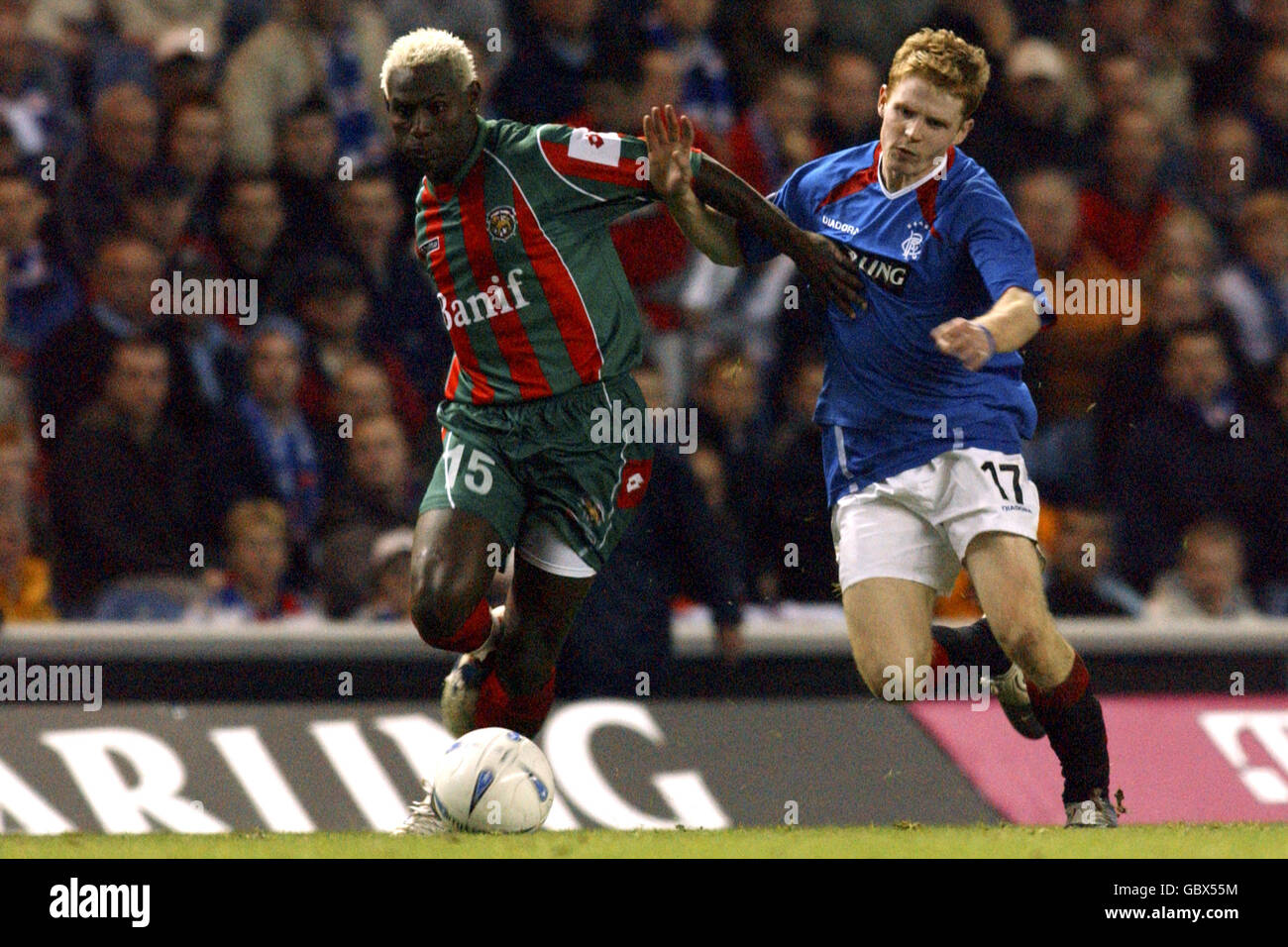 (L-R) Wenio, Maritimo and Rangers' Chris Burke battle for the ball Stock Photo