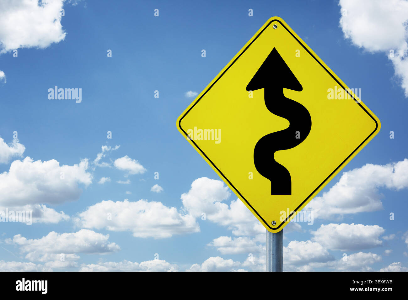 Winding arrow road sign concept for business difficulties, problems and confusion Stock Photo