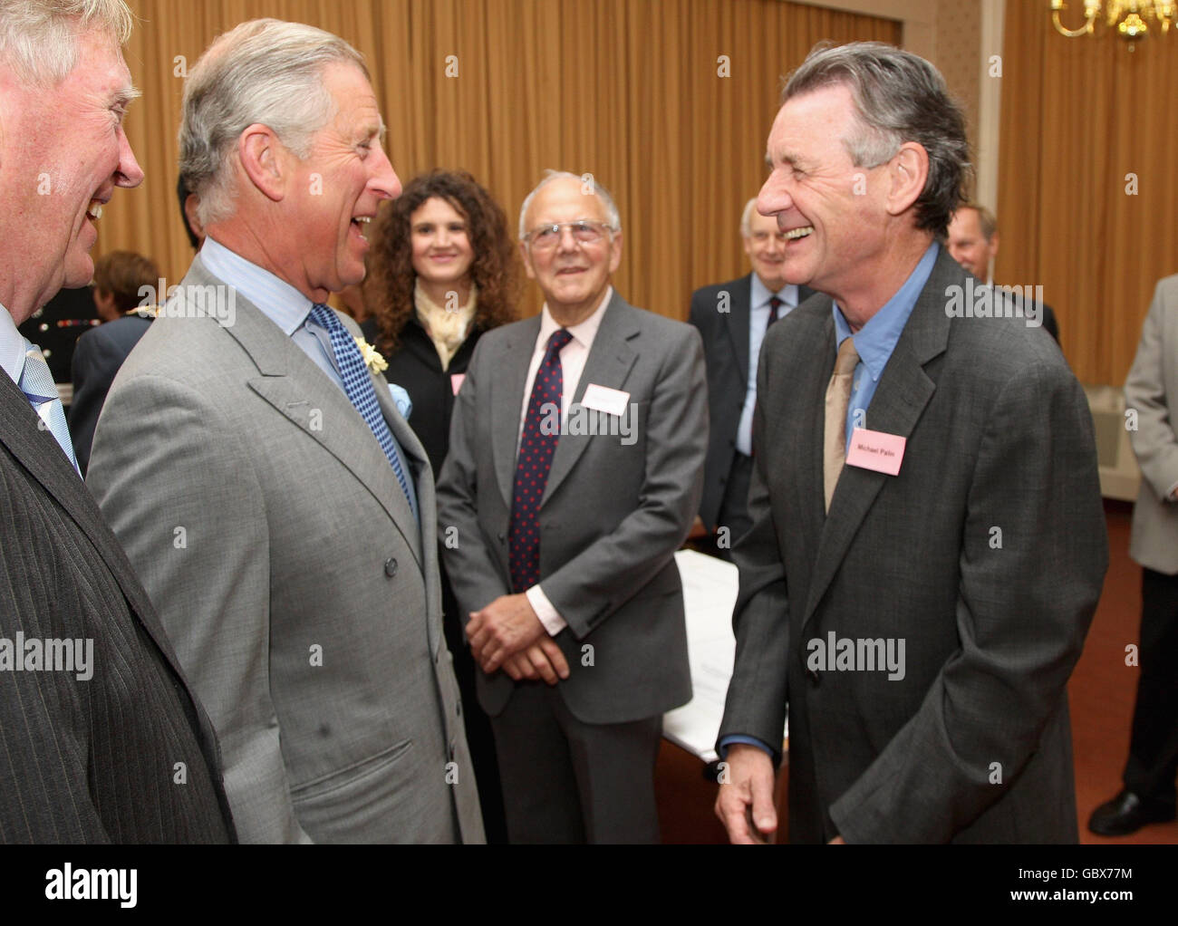 The Prince of Wales, centre, patron of the Almshouse Association, talks with residents and community leaders during a visit to St Pancras almshouses in north London to celebrate the 150th anniversary of the Almshouses. Stock Photo