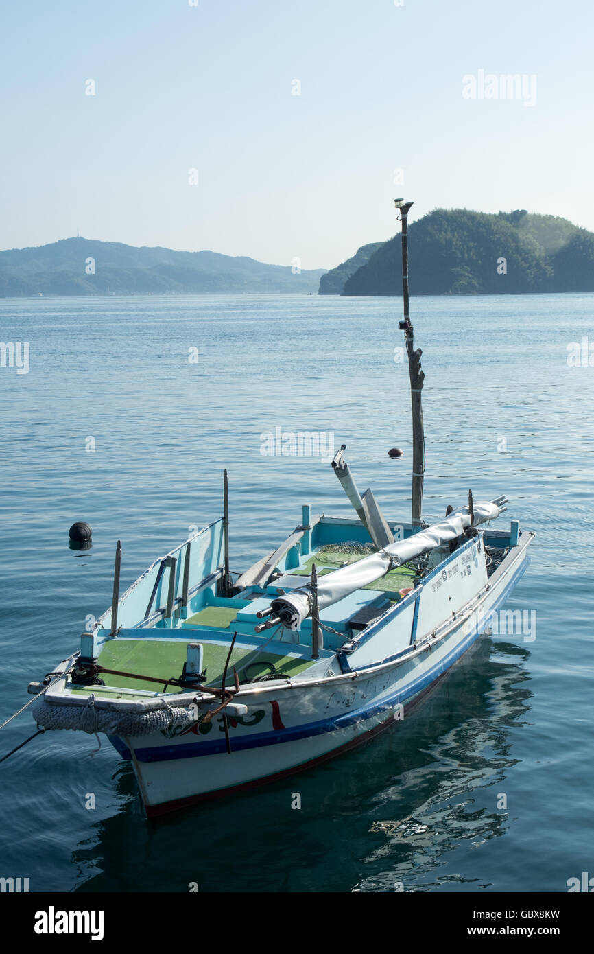 A wooden fishing boat moored in the Seto Inland Sea. Stock Photo