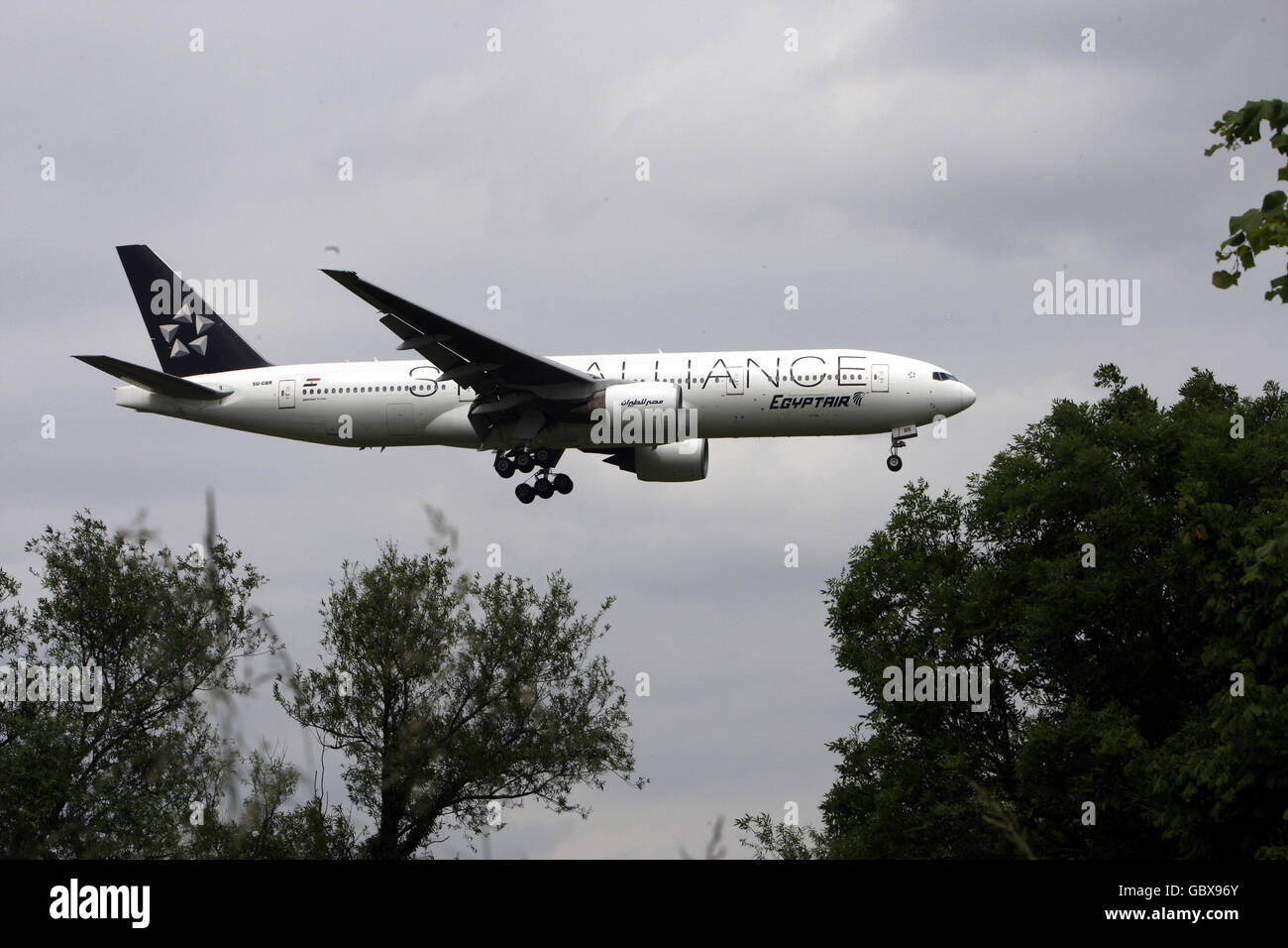 An Egyptair Boeing 777 plane lands at Heathrow Airport in Middlesex Stock Photo
