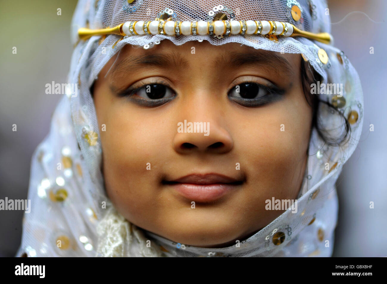 Kathmandu, Nepal. 07th July, 2016. A Potrait Mahijabin Phatma, 6.5 yrs old along with her parents come offer ritual morning prayers during celebration of Eid al-Fitr on July 7, 2016 in Kashmire Jame Mosques, Kathmandu, Nepal by attending special prayers in mosques, exchanging greetings with each other, wearing new clothes and eating a variety of dishes. Eid is celebrated as the conclusion of Ramadan's month-long dawn-to-sunset fasting. Nepalese goverment announced a public holiday for EID Celebration. Credit:  Narayan Maharjan/Pacific Press/Alamy Live News Stock Photo