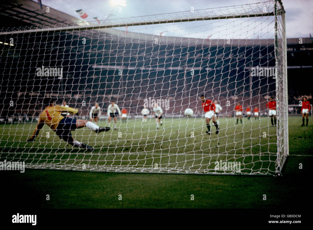 Portugal's Eusebio (r) sends England goalkeeper Gordon Banks (l) the wrong way from the penalty spot to score his team's goal Stock Photo