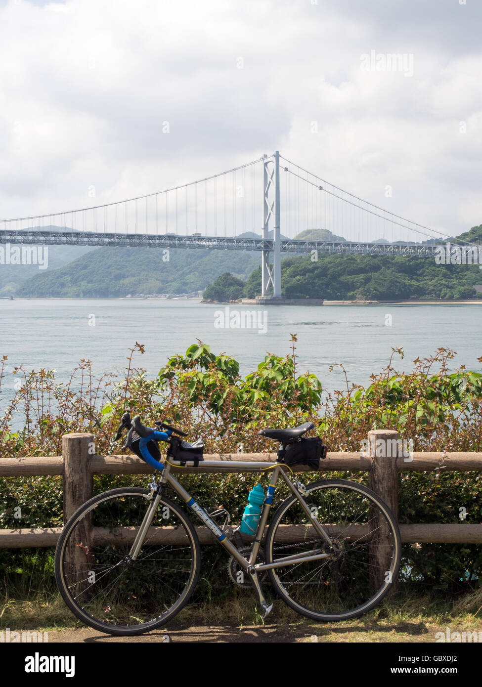 A titanium road bike and Innoshima Bridge. Stock Photo
