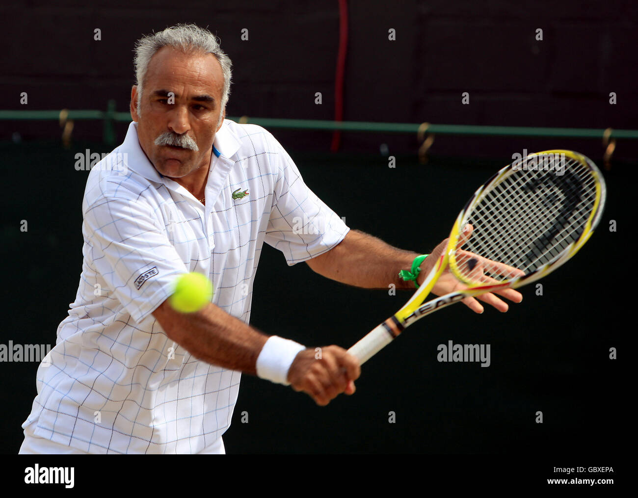 Tennis - 2009 Wimbledon Championships - Day Thirteen - The All England Lawn Tennis and Croquet Club. Iran's Mansour Bahrami during the Gentlemen's Senior Invitation Doubles final Stock Photo