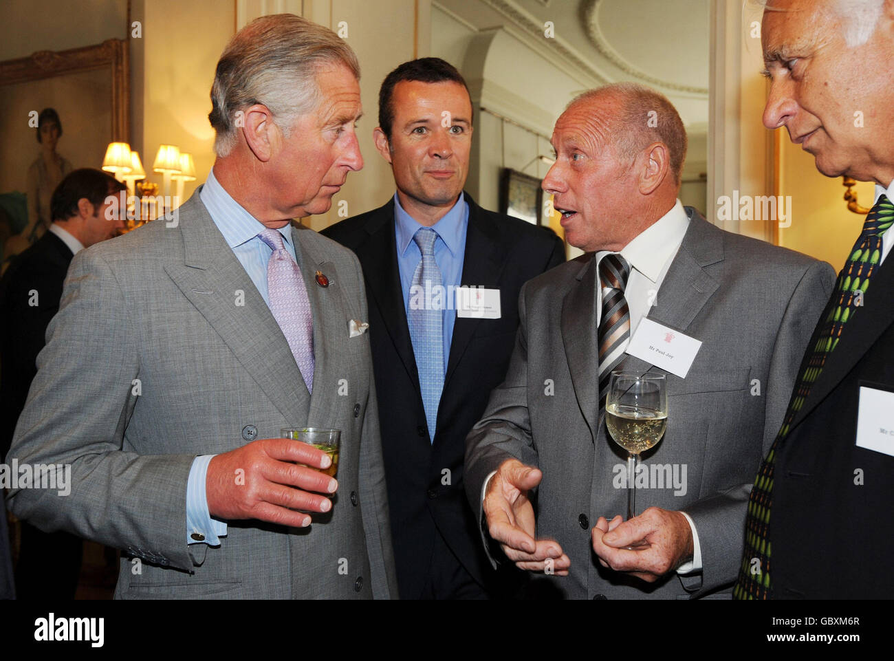 The Prince of Wales (left), talks with Hastings fisherman Paul Joy (second right) and Chief Executive of the Marine Stewardship Council, Rupert Howes (centre), at a reception at Clarence House to mark the 10th anniversary of the Marine Stewardship Council. Stock Photo