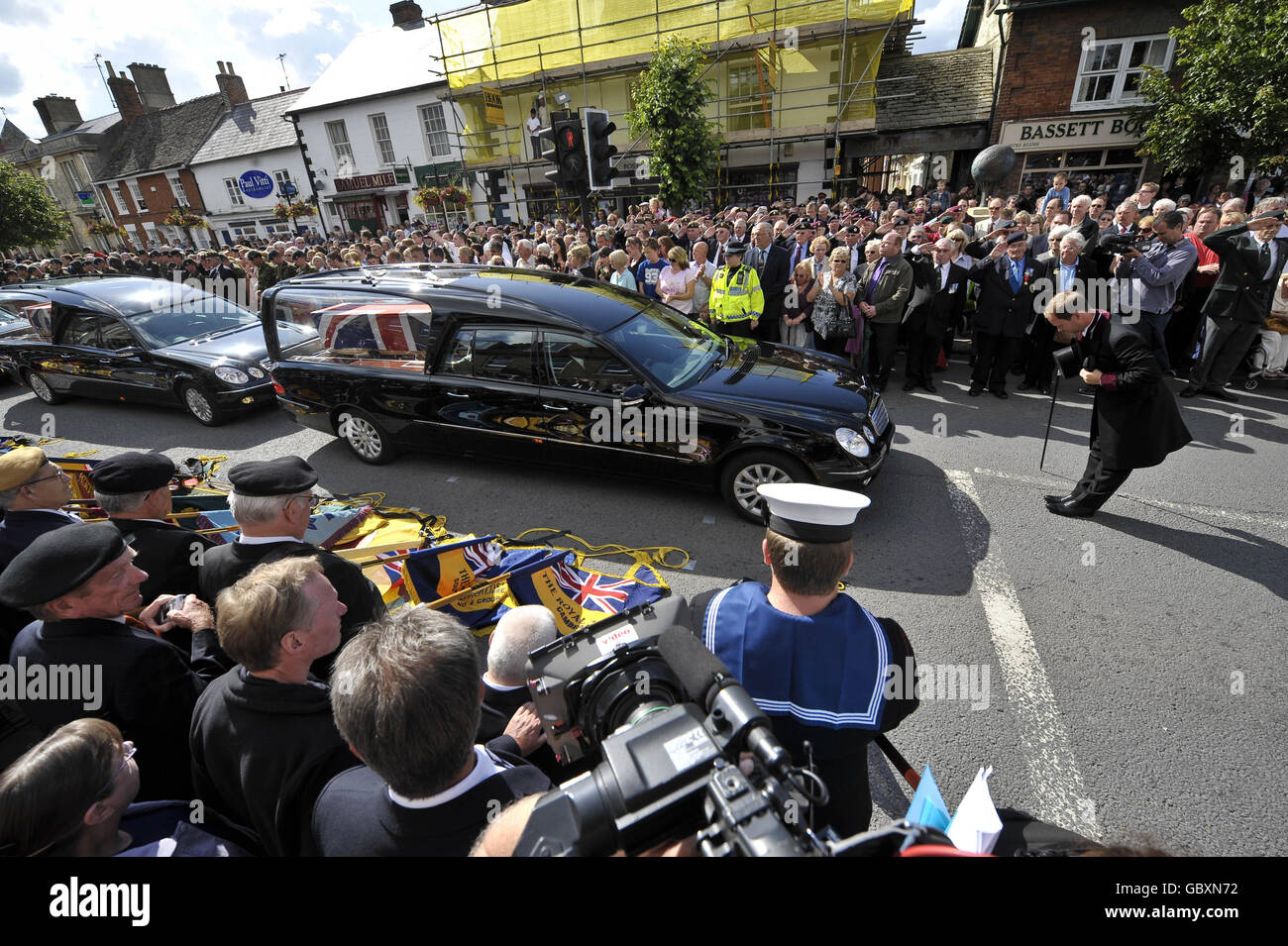 The Chief Mourner bows his head as eight hearses carrying the bodies of eight British soldiers killed during the Army's bloodiest 24 hours in Afghanistan, make their way through the Wiltshire village of Wootton Bassett. Stock Photo
