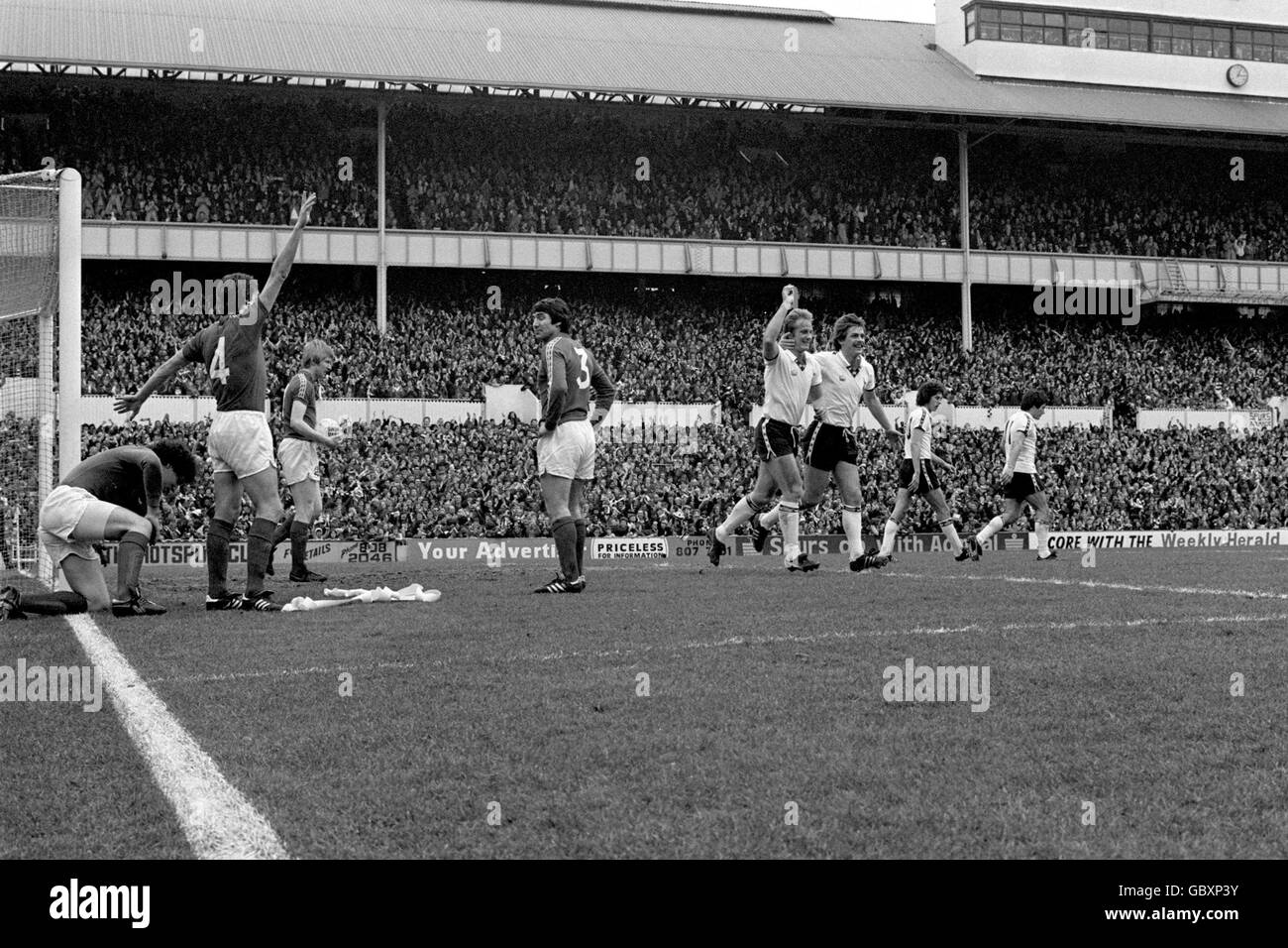 Tottenham Hotspur's Don McAllister (fourth r) celebrates with teammate Jim Holmes (third r) after scoring the winning goal Stock Photo