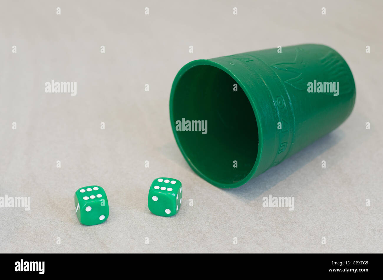 Green dice and shaker, double six Stock Photo