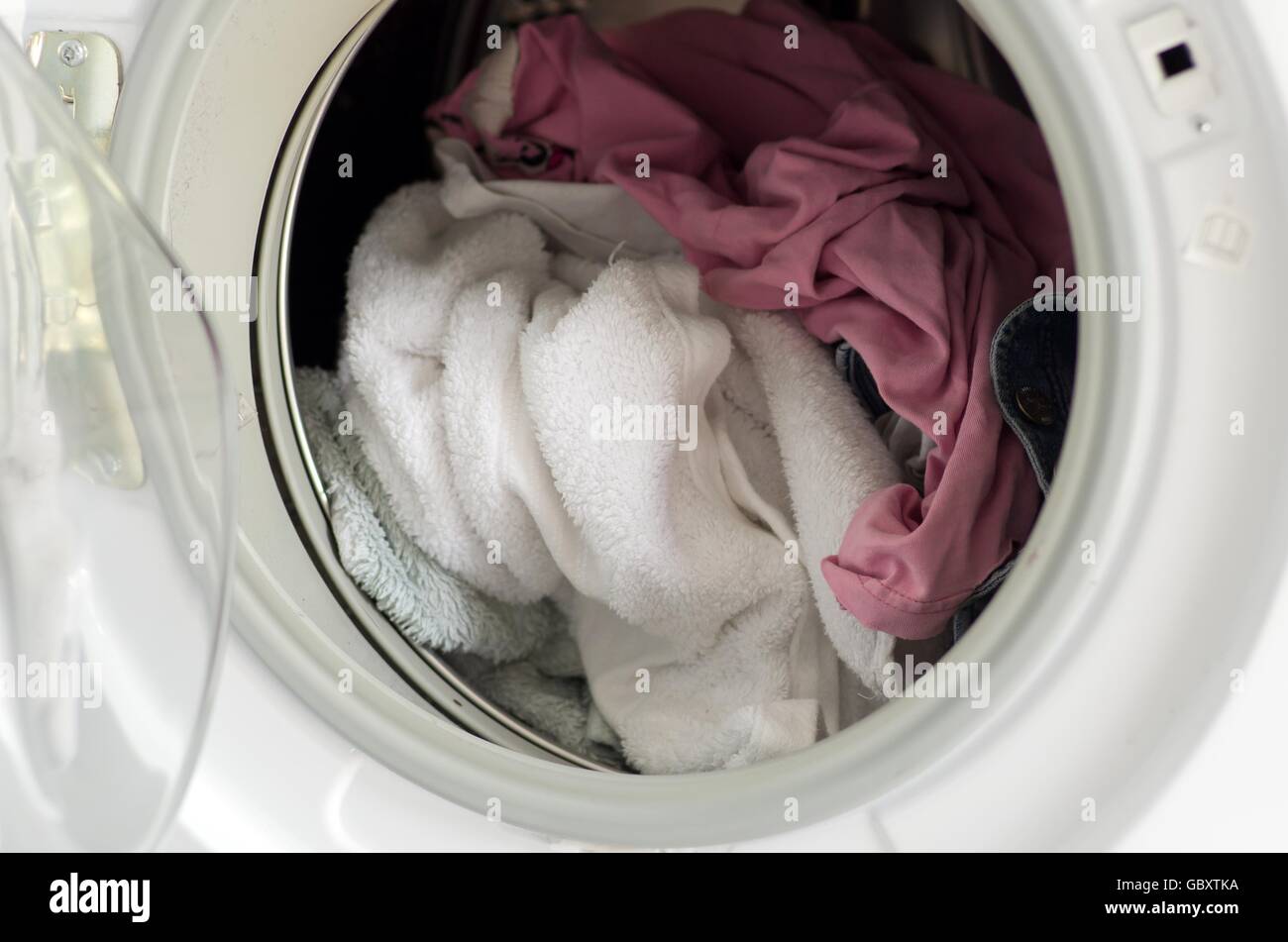 Clothes in a washer dryer Stock Photo Alamy
