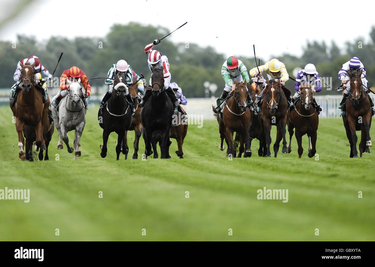 Monsieur Chevalier ridden by Richard Hughes (third right) races clear of the field to go on to win the Weatherbys Super Sprint during Weatherbys Super Sprint Day at Newbury Racecourse, Berkshire. Stock Photo