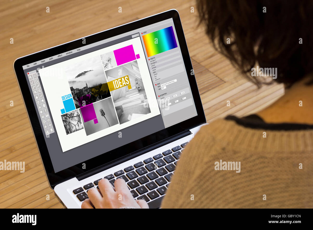 graphic design concept: design layout on a laptop screen. Screen graphics are made up. Stock Photo